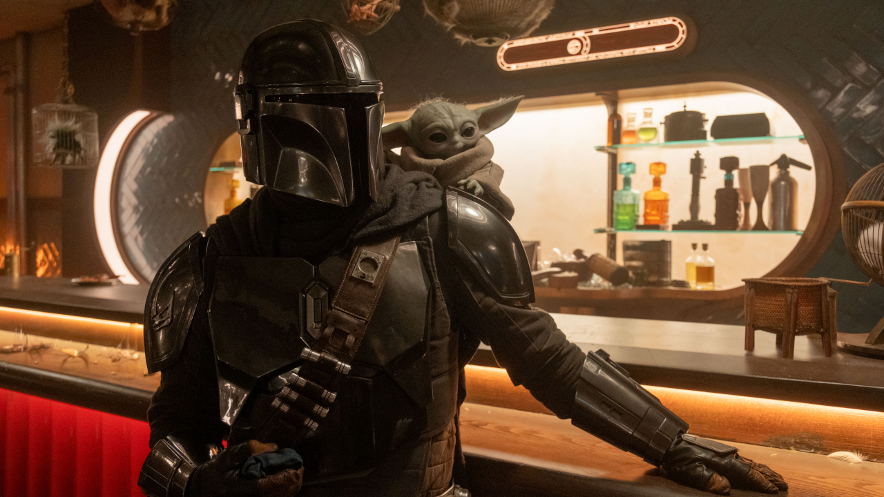 Din Djarin (Pedro Pascal) and Grogu look ahead in The Mandalorian and Grogu.