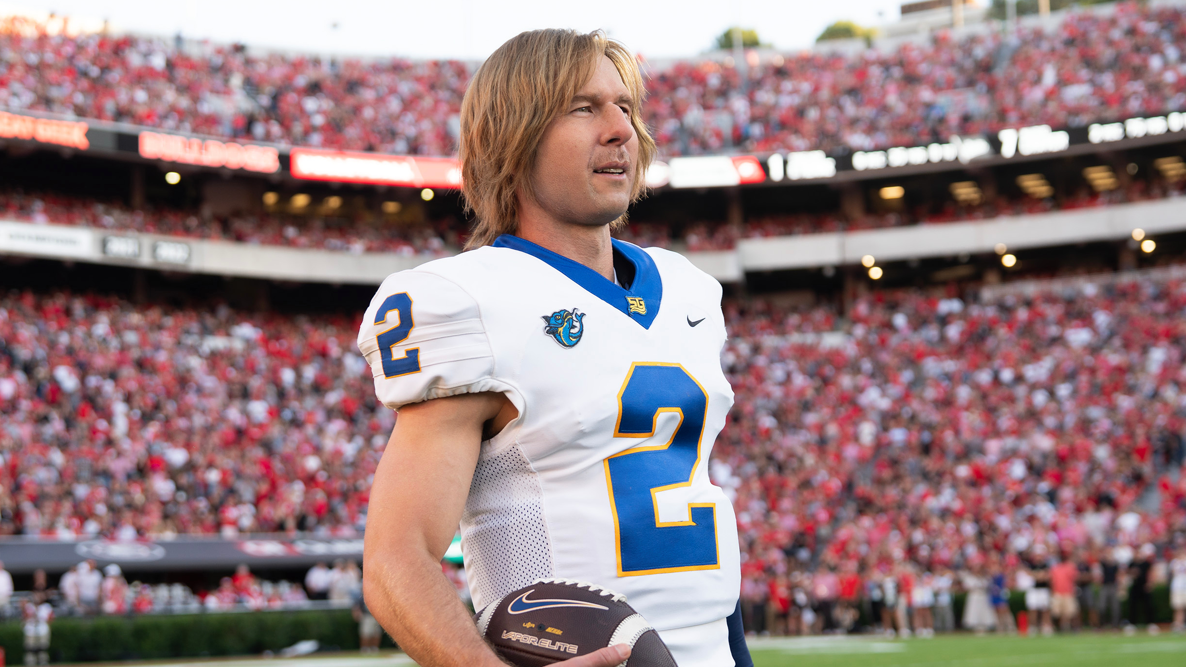 Chad Powers (Glen Powell) in his football jersey in the "Chad Powers" season finale