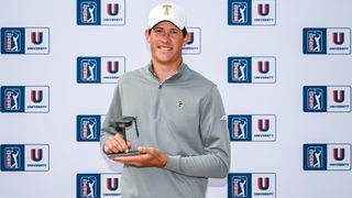 Christo Lamprecht of Georgia Tech smiles with a trophy after finishing second in the PGA TOUR University rankings