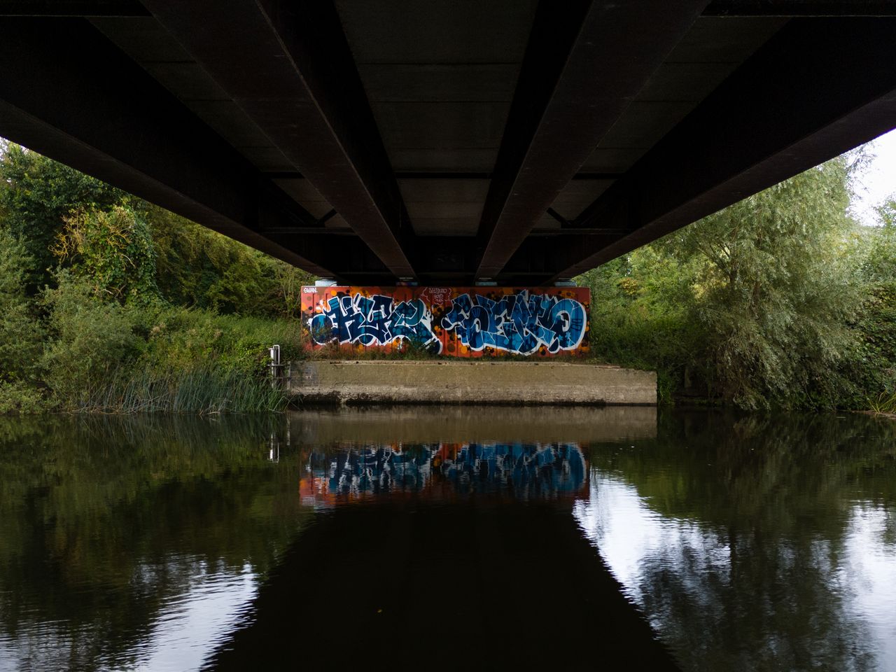 Photo of graffiti under a bridge taken with the DJI Mini 4 Pro