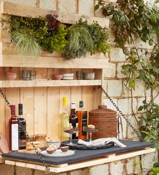 garden bar with bottles and brick wall