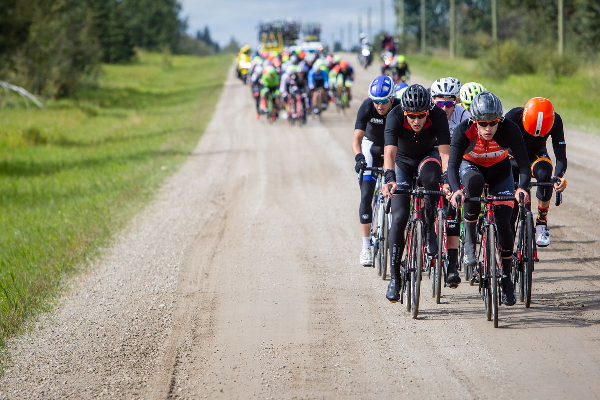 A group tries to get away in the dirt section during stage 3 at the Tour of Alberta