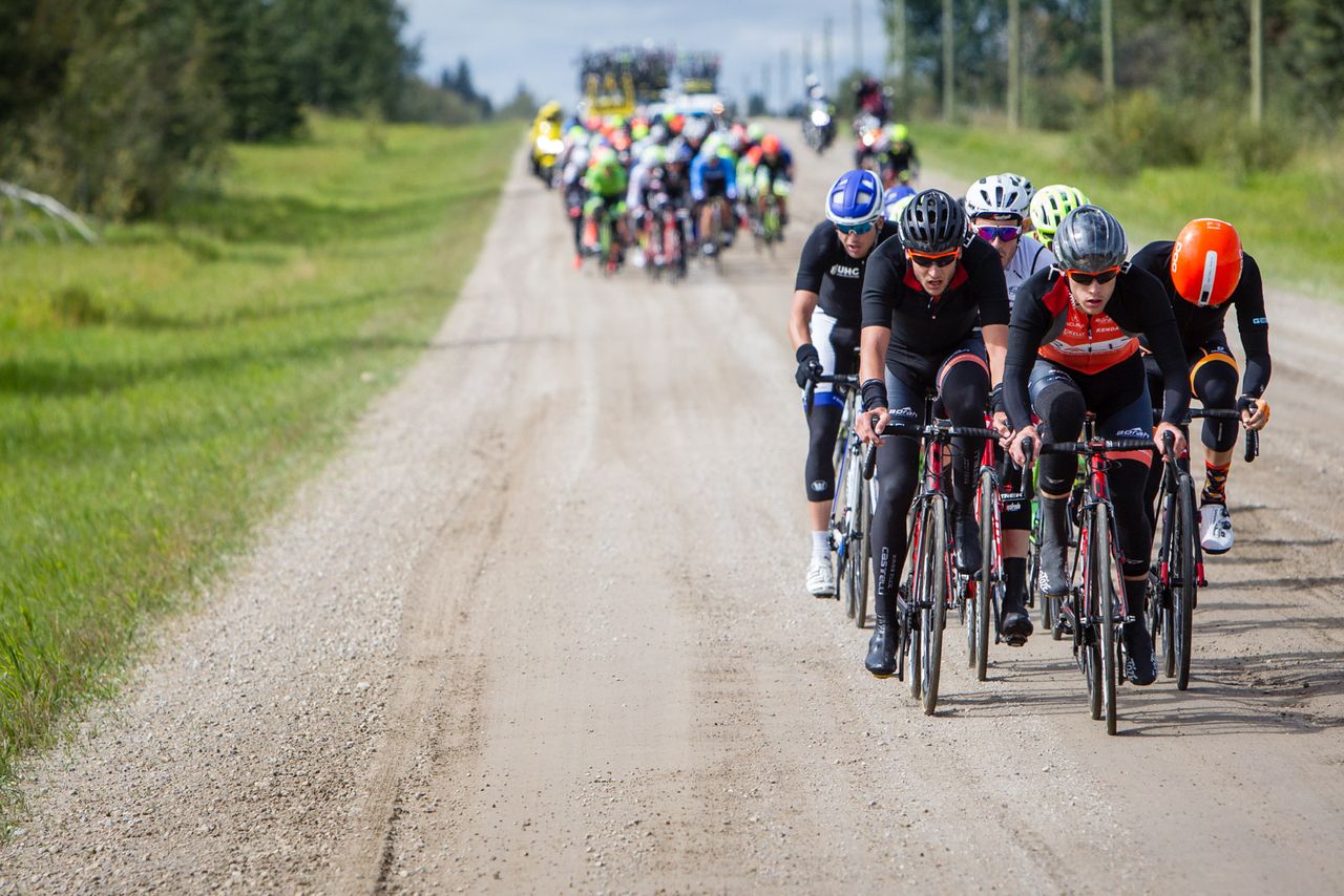 A group tries to get away in the dirt section during stage 3 at the Tour of Alberta
