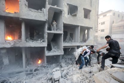 Syrians search for survivors after a bombing