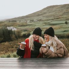 Two women on an autumn walk in the countryside