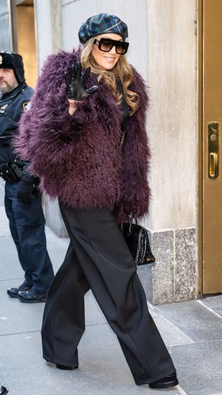 Jennifer Lopez wearing burgundy coat