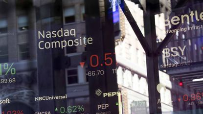 Nasdaq Composite stock market information outside of Nasdaq building in New York City