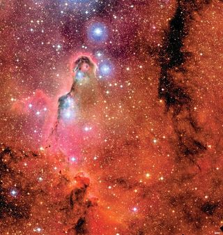The Elephant's Trunk Nebula sits in star cluster IC 1396, in the constellation of Cepheus. A cloud of high-temperature gas warmed up by newly born stars forms the emission nebula. Hydrogen, the most common element in space, glows intensely in red light w