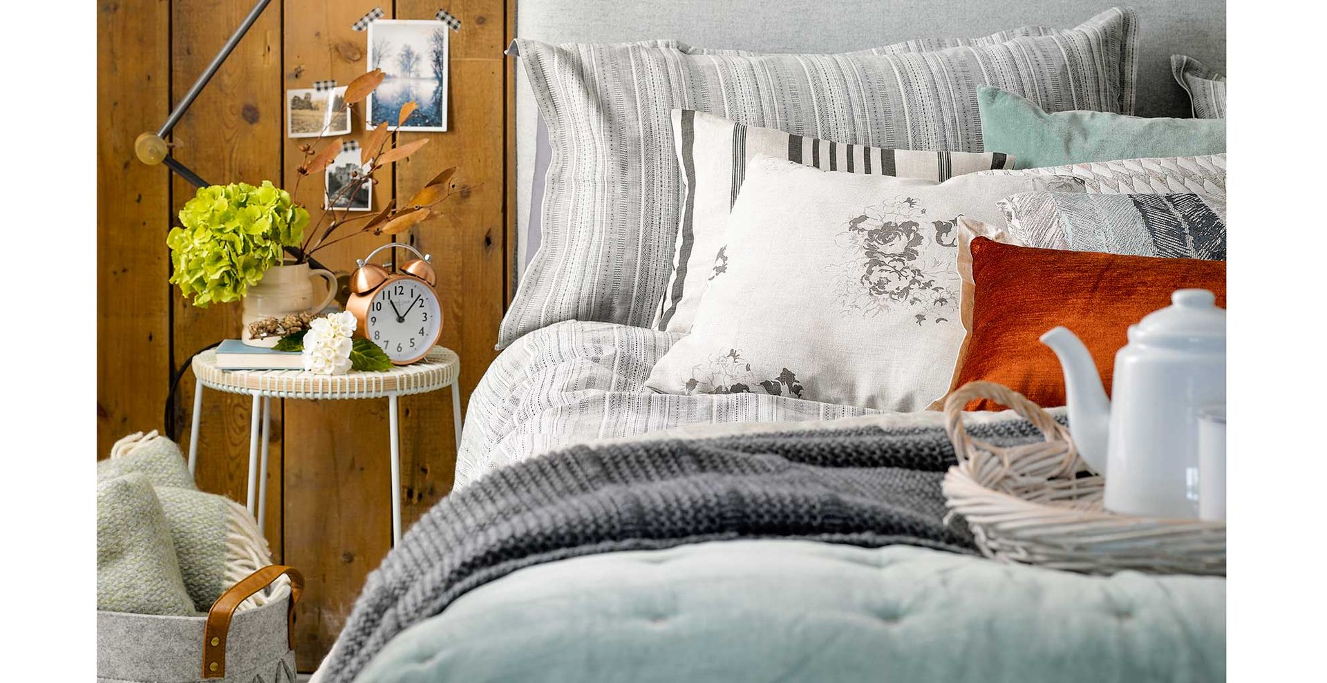 cosy bedroom with photograph on the wall beside the bed