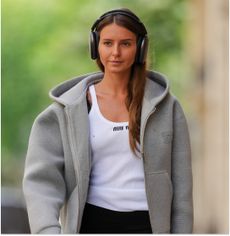 woman wearing a hoodie street style 2024