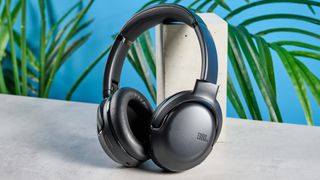 the JBL Tour One M2 headphones with black cups and a black exterior with bluetooth and 2.5mm jack connections