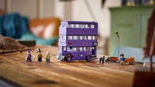 Lego Knight Bus and minifigures on a wooden table