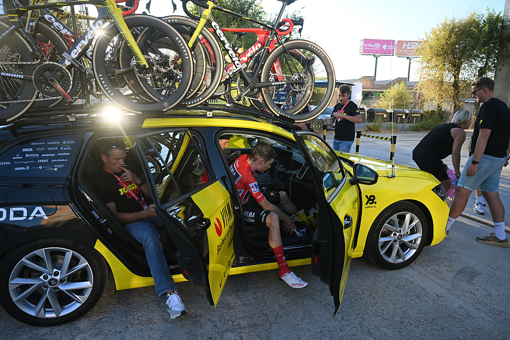(L-R) Head of Racing of Team Visma- Lease a Bike Grischa Niermann and race leader Jonas Vingegaard after the La Vuelta is neutralised due to disturbances in central Madrid caused by pro-Palestinian protests
