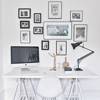 study room with bright white wall and desk with computer and chair