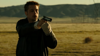 Brad Pitt pointing a gun at the end of Seven