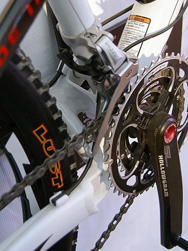 Asymmetrical chain stays are joined by a substantial-looking bridge.
