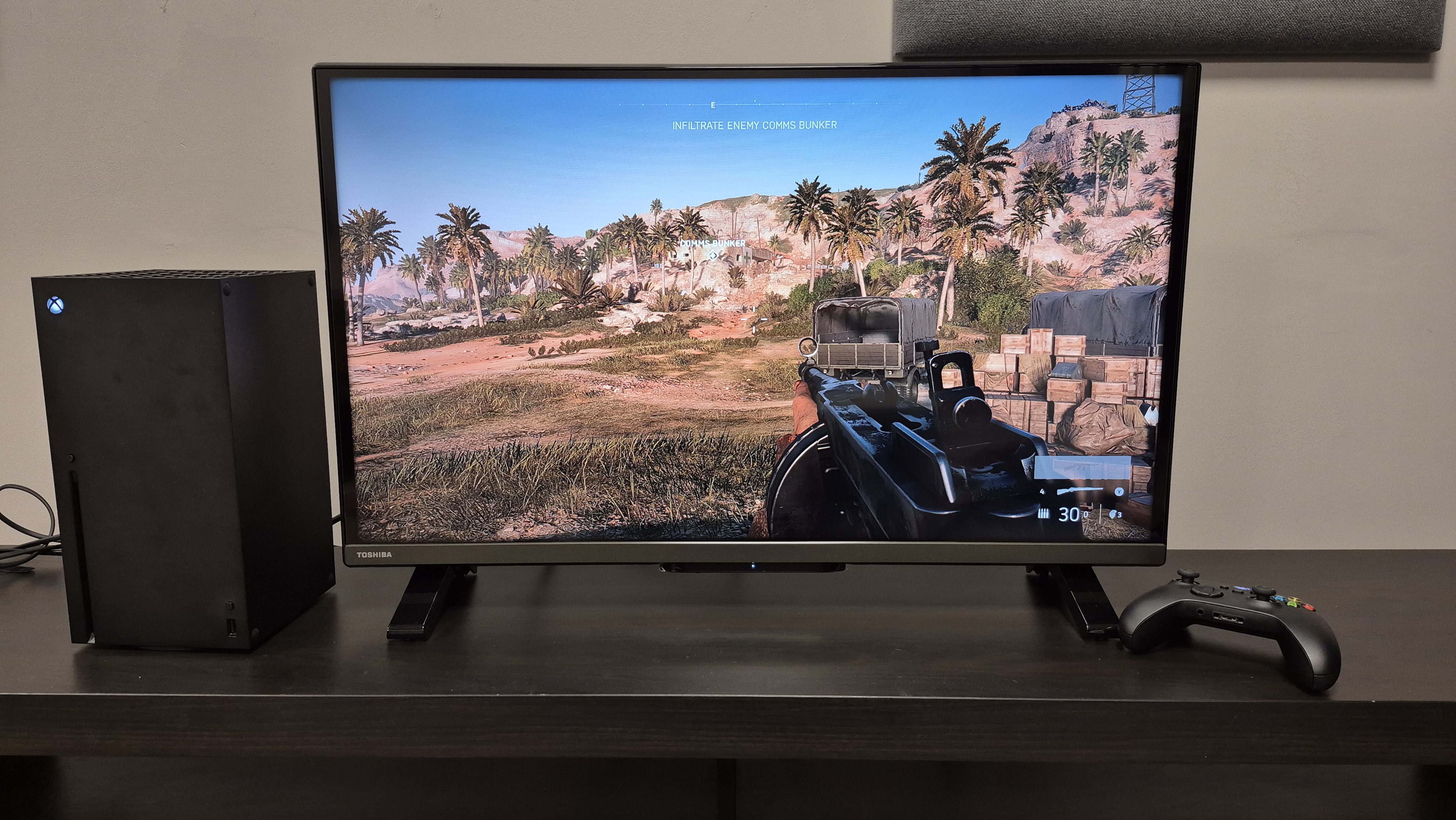 Toshiba 32LF2F53DB on TV unit with XBox Series X and controller