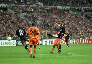 Steve McManaman scores for Real Madrid against Valencia in the 2000 Champions League final.