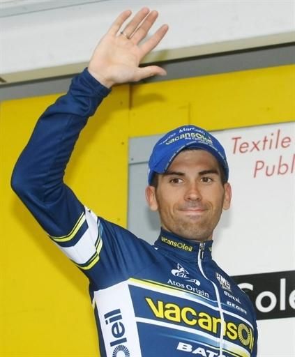 Adam Blythe (Omega Pharma - Lotto) waves from the top step of the podium after stage 3.