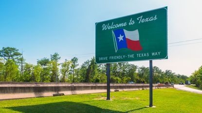Welcome to Texas sign for electric vehicle tax