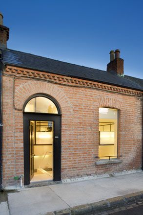 Brick house with large door & window