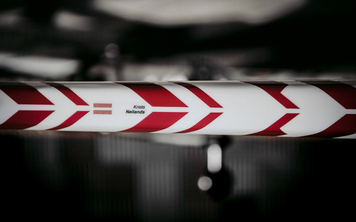 The striped geometric design meet on the top tube to form forward facing chevrons