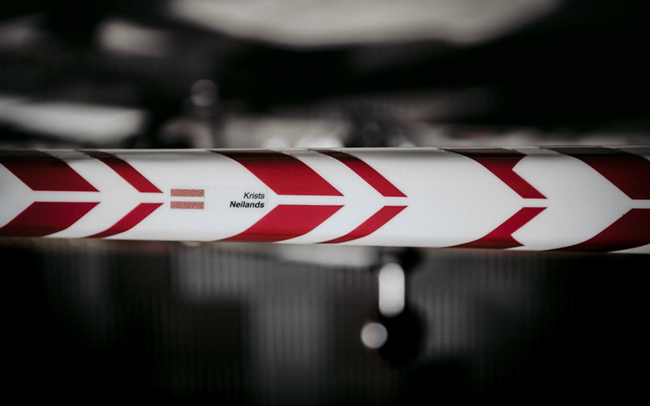 The striped geometric design meet on the top tube to form forward facing chevrons