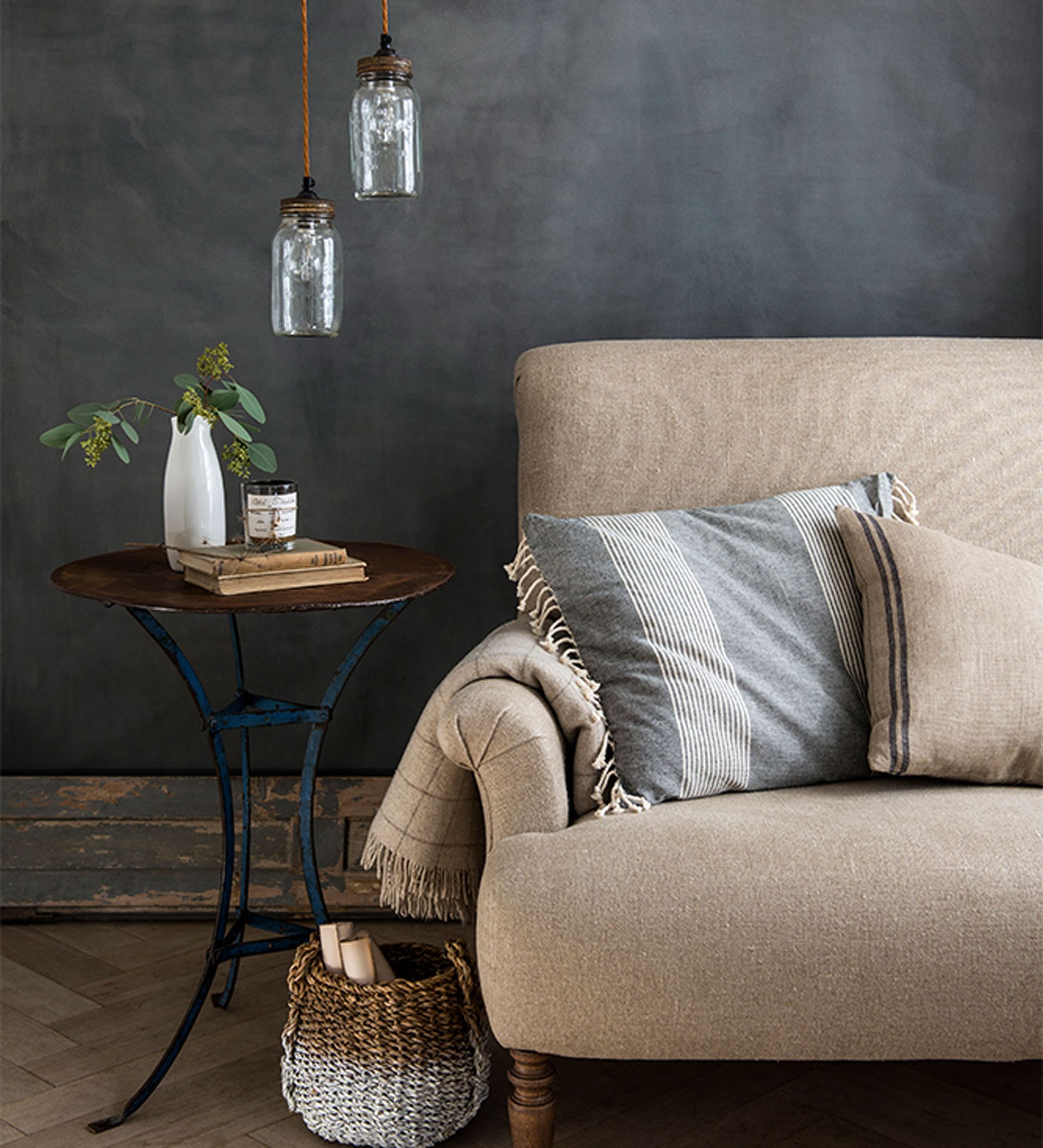living room with black chalkboard wall and armchair