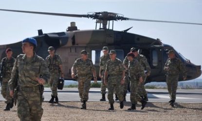 Turkey's Chief of General Staff Necdet Ozel arrives at Oncupinar border outpost on the Turkish-Syrian border on Oct. 9 as tensions with Syria begin to boil over.