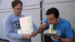 Michael eating fettuccine alfredo with Dwight in The Office