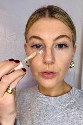 Rare Beauty Liquid Touch Brightening Concealer being worn by a beauty editor