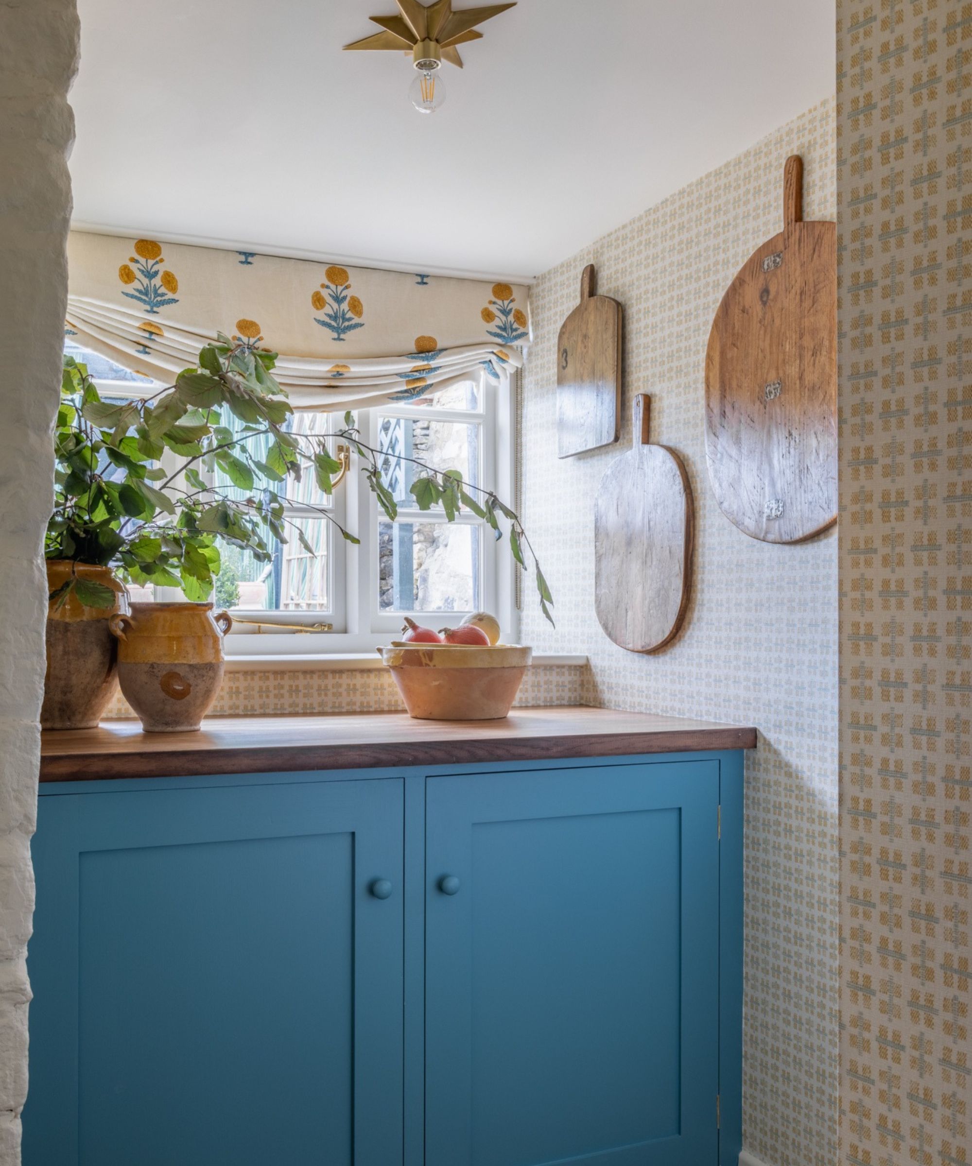 Sean Symington utility room with French antique confit pots and wooden boards