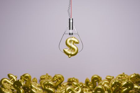 Claw machine grabbing gold dollar signs