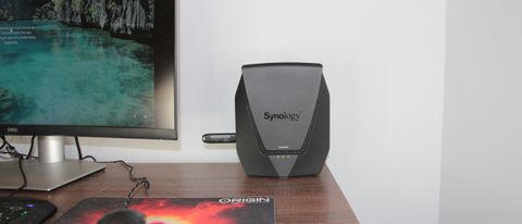 Various images of the Synology WRX560 router hardware.
