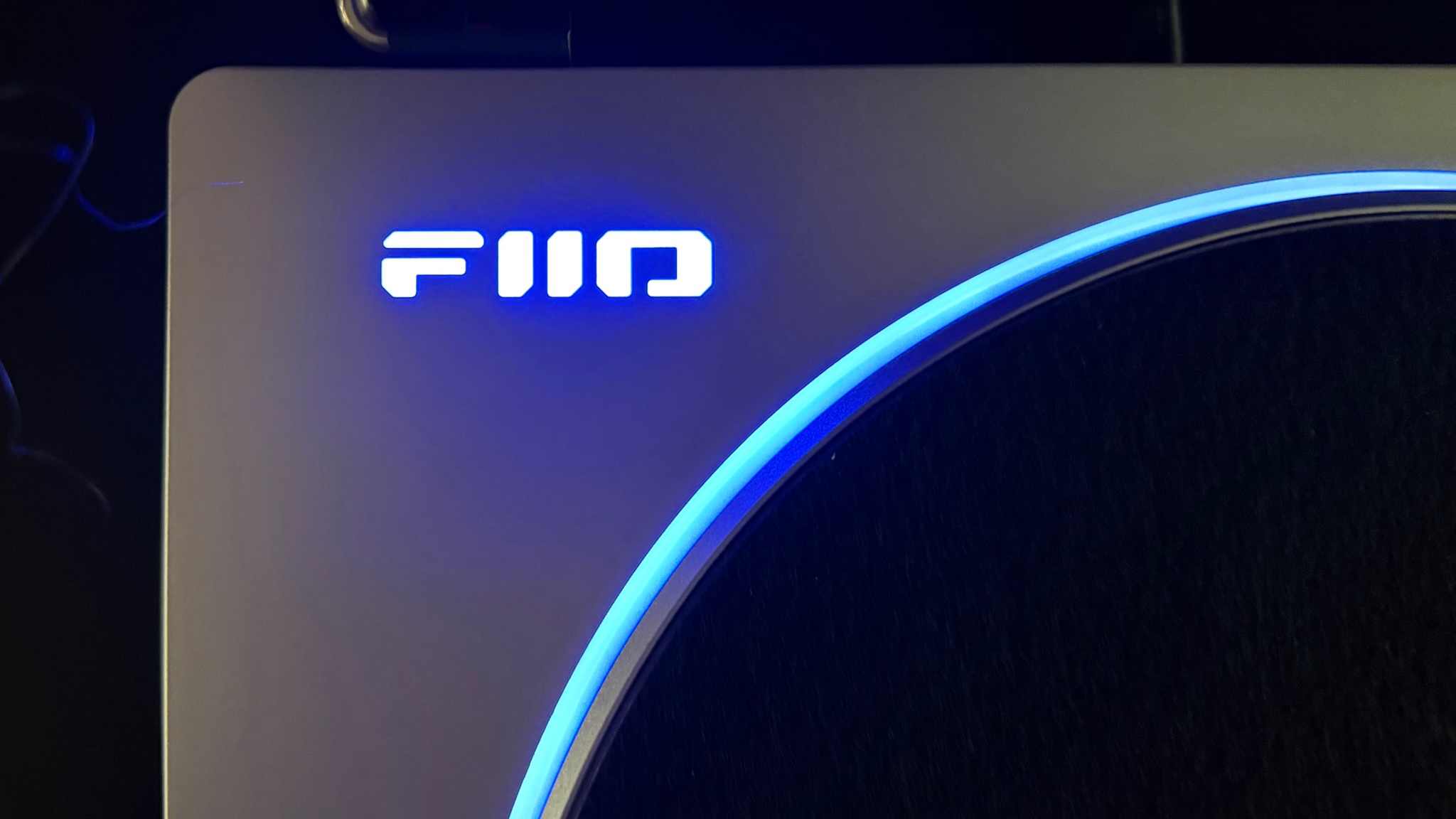 FiiO TT13 turntable illuminated logo close up in blue