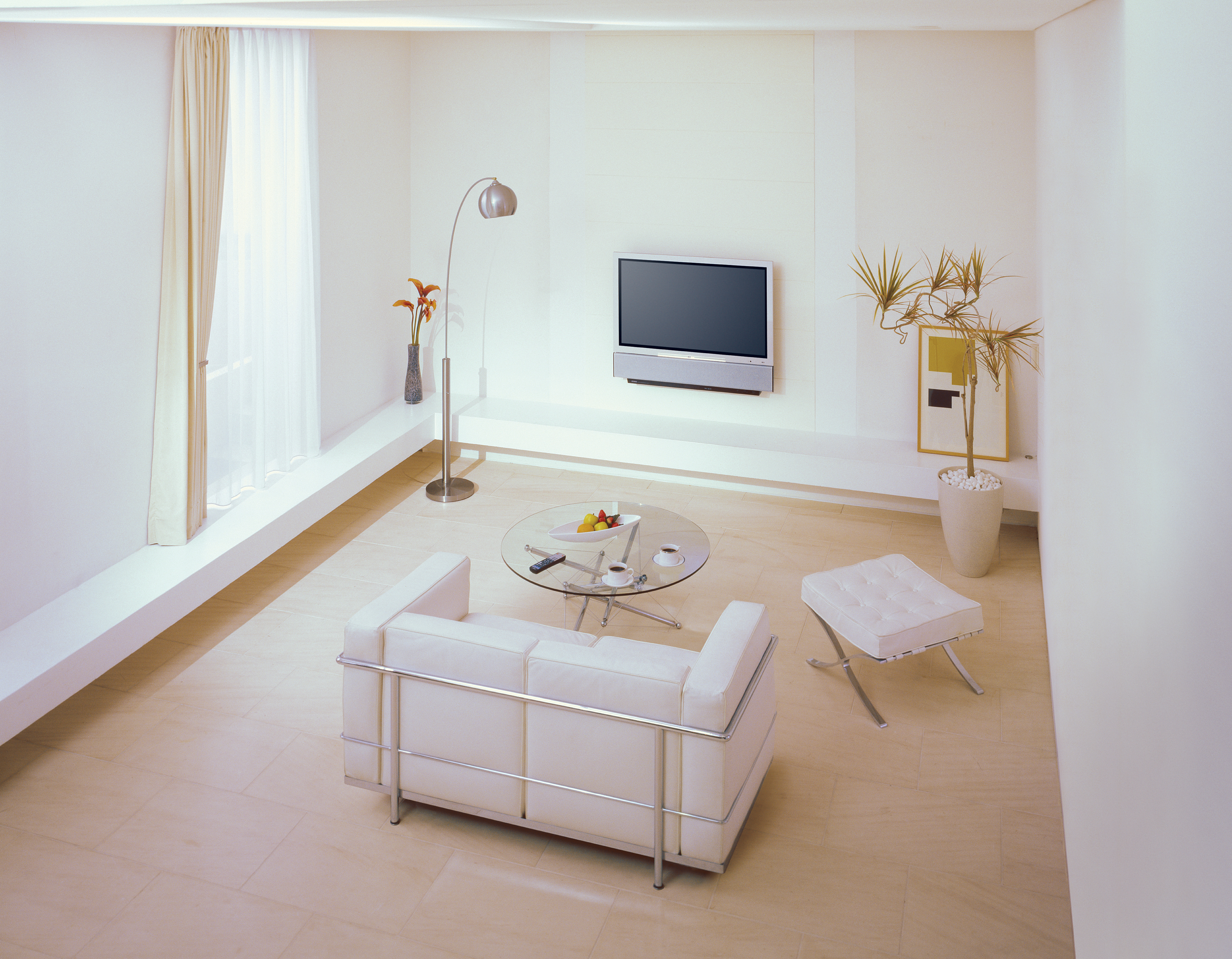 Yamaha YSP-1 wall-mounted in a sparce living room