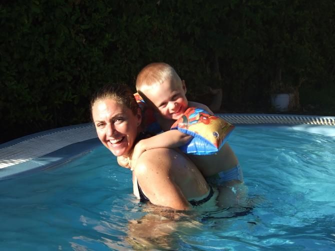 Gunn-Rita Dahle Flesjaa enjoys swimming with her son Bj&oslash;rnar