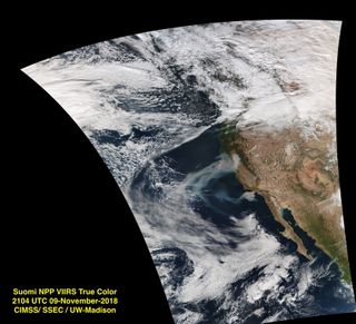 NOAA's Suomi NPP satellite spotted two plumes of smoke streaming off California's burning lands on Nov. 9, 2018.