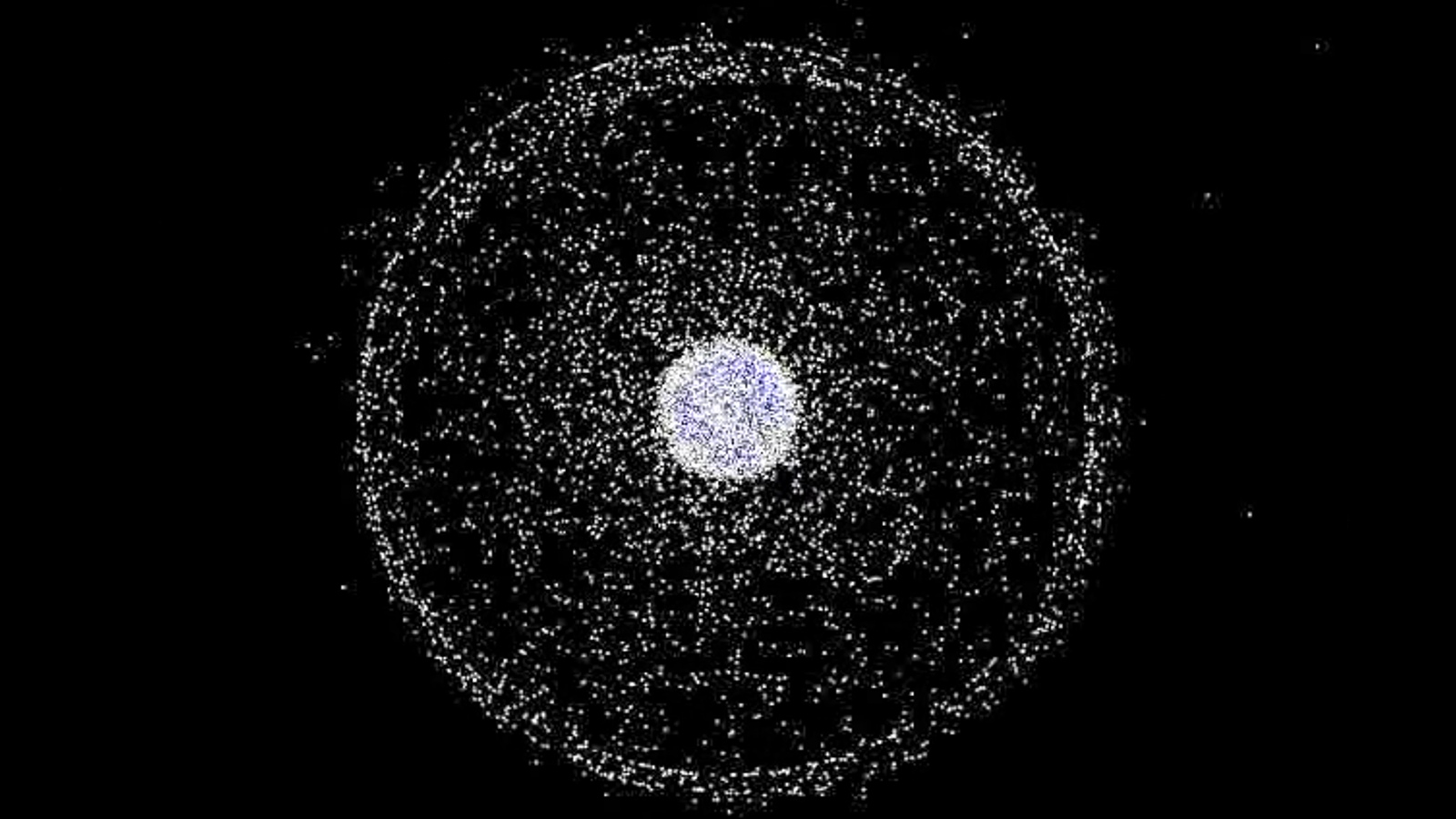 Earth surrounded by white dots that represent space junk