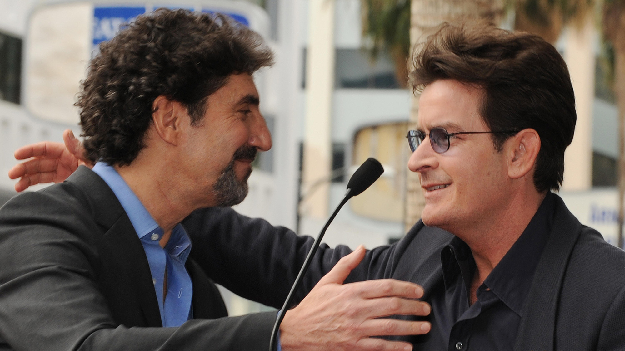 Chuck Lorre and Charlie Sheen hug in better times during his 2009 Hollywood Walk of Fame ceremony.