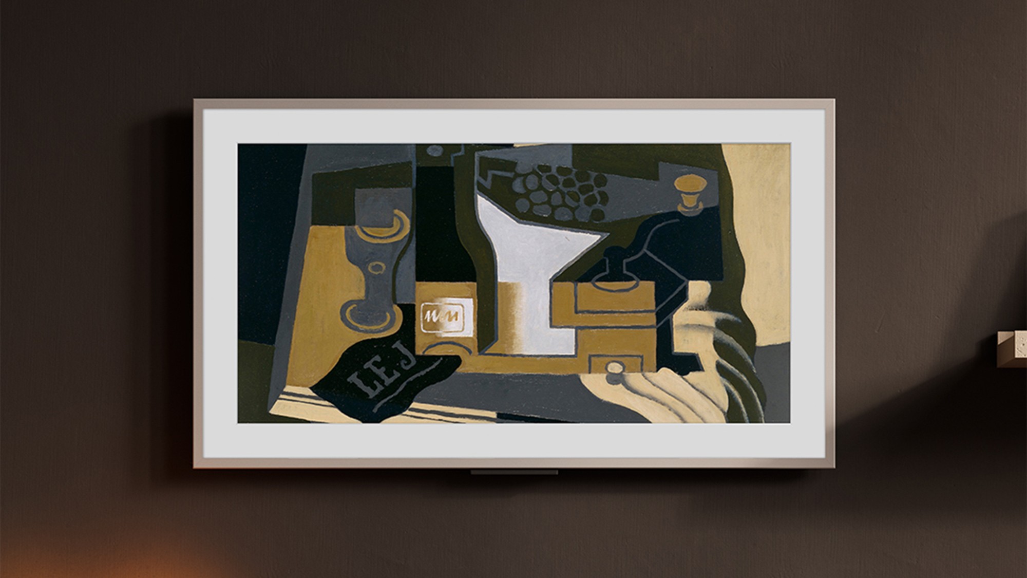 The Amazon Ember Artline TV on a dark brown background displaying a piece of art.