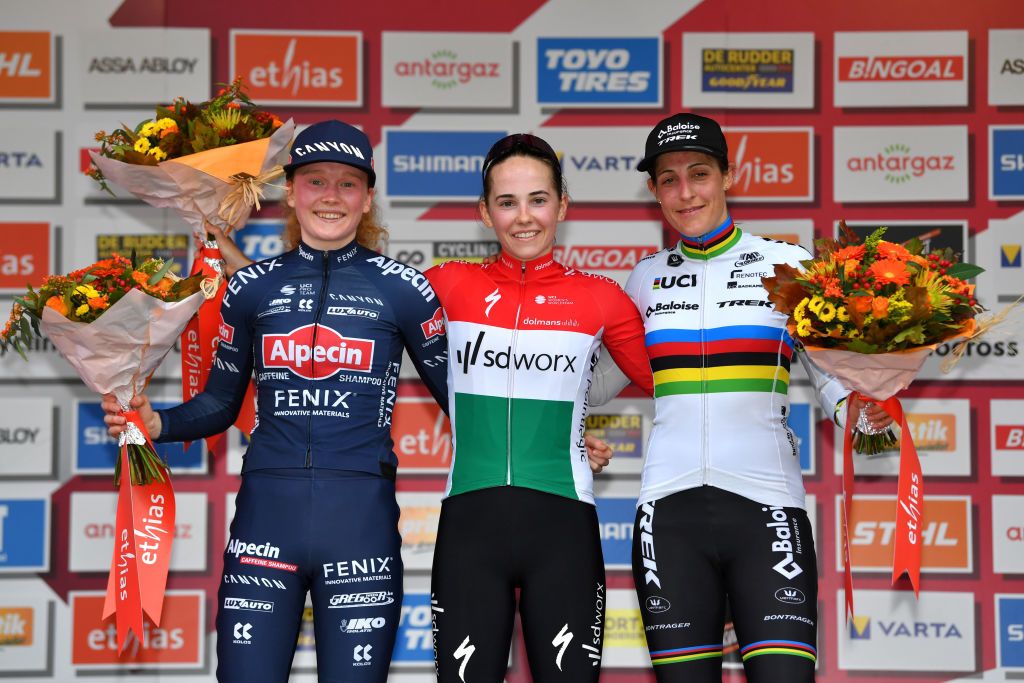 OVERIJSE BELGIUM OCTOBER 31 LR Puck Pieterse of The Netherlands and Team Alpecin Fenix on second place race winner Blanka Vas Kata of Hungary Team SD Worx and Lucinda Brand of The Netherlands and Team Baloise Trek Lions on third place pose on the podium ceremony after the 62nd Druivencross Overijse UCI CycloCross Worldcup 2021 Womens Elite DruivencrossOverijse CXWorldCup UCIcyclocrossWC on October 31 2021 in Overijse Belgium Photo by Luc ClaessenGetty Images