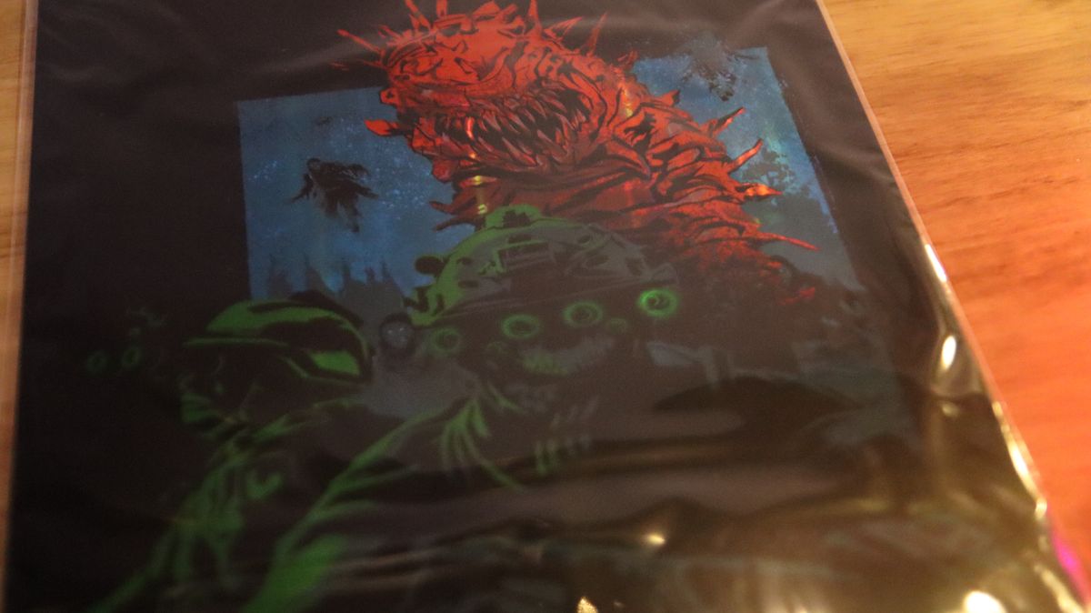 Call of Duty: Modern Warfare 3 Collectors Box items include lithographic prints, a metallic poster, and enamel pins.