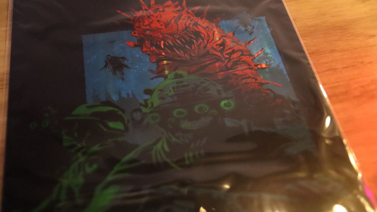 Call of Duty: Modern Warfare 3 Collectors Box items include lithographic prints, a metallic poster, and enamel pins.