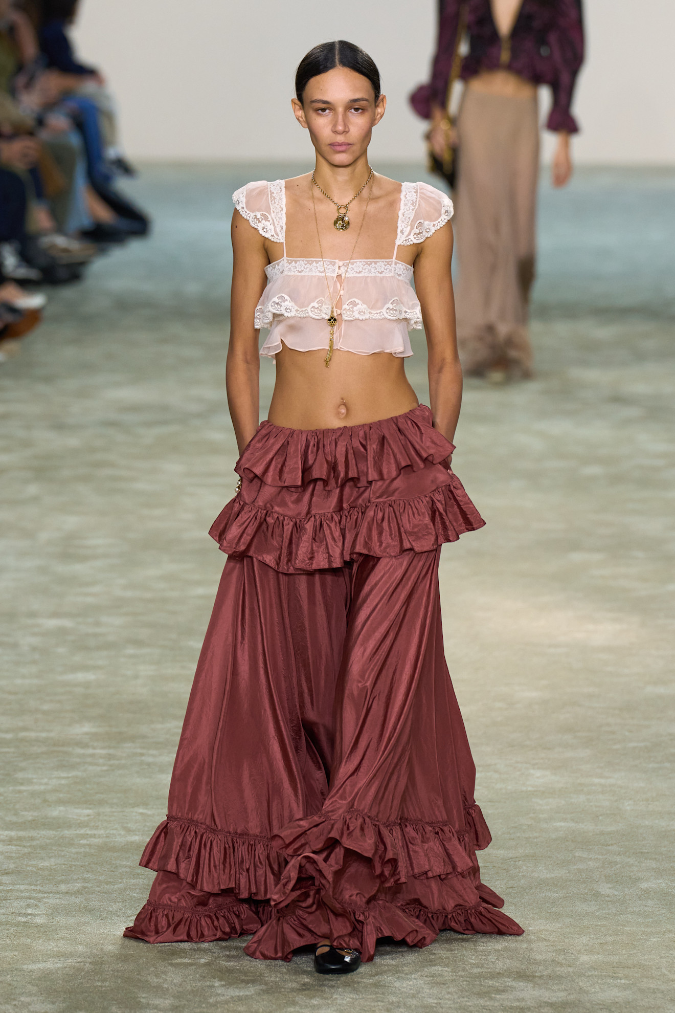 An image of the sheer blouse trend on the Chloe SS25 runway.