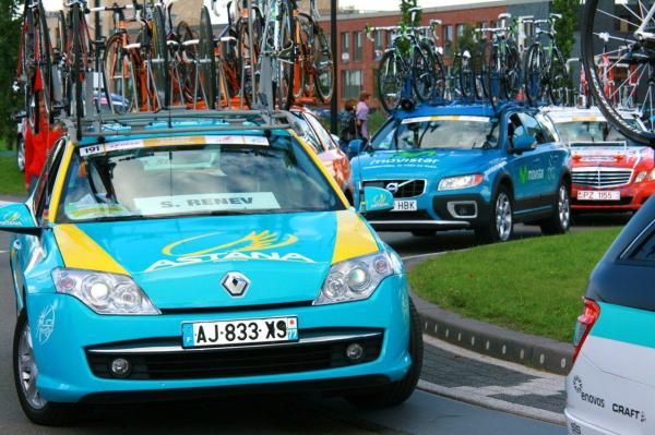Team cars lined up and ready to follow riders