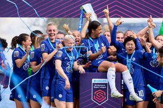 Chelsea celebrate with the FA Women’s Super League trophy