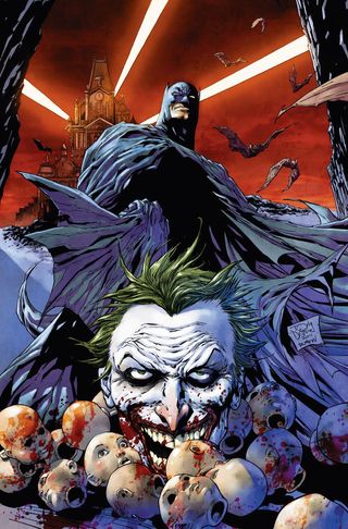 Batman looking down on the Joker surrounded by doll heads