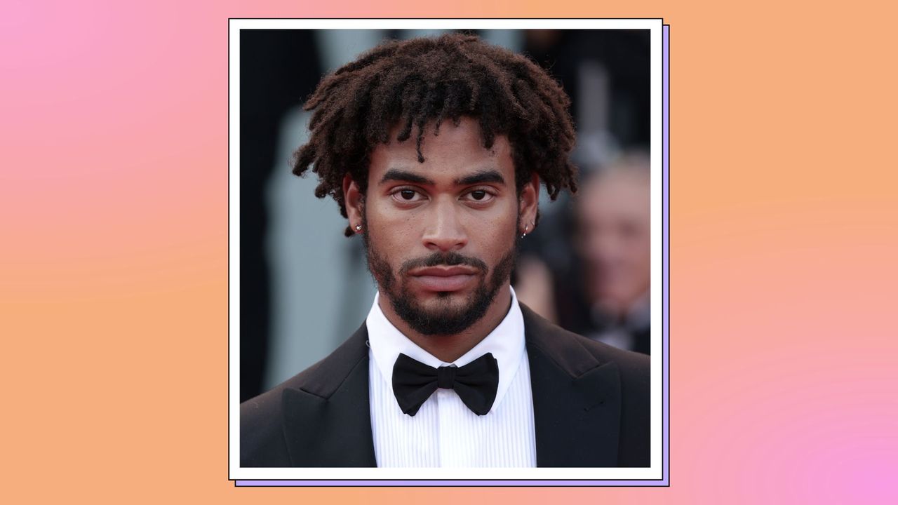 Jordan Hames, Love Island season 5 castmember pictured as he attends the opening ceremony of the 79th Venice International Film Festival at Palazzo del Cinema on August 31, 2022 in Venice, Italy./ in a pink and orange template