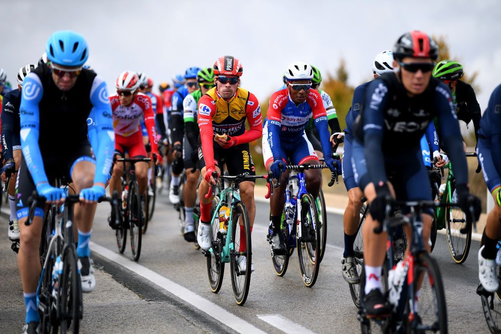 EJEADELOSCABALLEROS SPAIN OCTOBER 23 Primoz Roglic of Slovenia and Team Jumbo Visma Red Leader Jersey Lorrenzo Manzin of France and Team Total Direct Energie during the 75th Tour of Spain 2020 Stage 4 a 1917km stage from Garray Numancia to Ejea de los Caballeros lavuelta LaVuelta20 La Vuelta on October 23 2020 in Ejea de los Caballeros Spain Photo by David RamosGetty Images